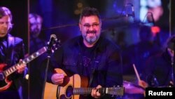 FILE - Musician Vince Gill performs at a gala at the Rainbow Room, Oct. 8, 2018, in New York.