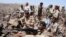 A handout photo from Yemen's Defense Ministry shows Yemeni troops taking position during the fight against al-Qaida militants in the southern province of Shabwa, April 30, 2014.