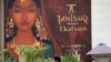 People are seen outside a Tanishq jewelry store in Mumbai, India, Oct. 14, 2020. 