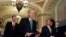 FILE - Senators Mitch McConnell (foreground) and Lindsey Graham approach a podium to speak to the media on Capitol Hill in Washington.