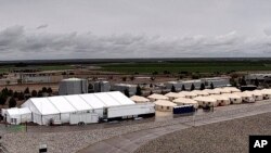 FILE - This undated photo provided by the Administration for Children and Families, a division of the Department of Health and Human Services, shows the shelter used to house unaccompanied migrant children in Tornillo, Texas. 