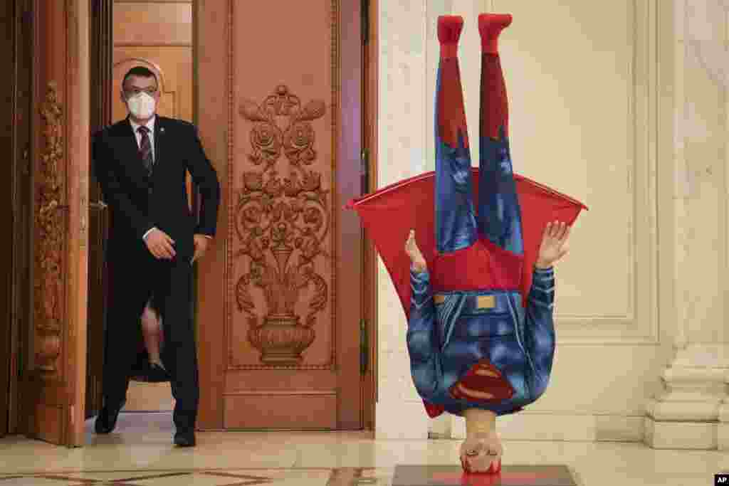 A mannequin depicting Superman is placed upside down next to the door of the parliament session hall hosting a no confidence vote agains Romanian Prime Minister Florin Citu&#39;s government in Bucharest, Romania.