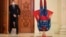 A mannequin depicting Superman is placed upside down next to the door of the parliament session hall hosting a no confidence vote agains Romanian Prime Minister Florin Citu's government in Bucharest, Romania, Tuesday, Oct. 5, 2021.