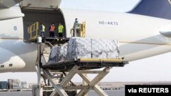 Staff members of King Salman Humanitarian Aid and Relief Center unload humanitarian aid at Beirut International airport to provide support following Tuesday's blast, Lebanon, August 8, 2020.