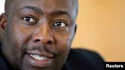 FILE - Zimbabwe's Minister of Youth Development, Indigenization and Empowerment Saviour Kasukuwere speaks during the Reuters Africa Investment Summit in Sandton, April 16, 2012. 