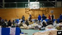 Japanese evacuees at Koriyama High School gymnasium, Koriyama, Fukushima Prefecture, Japan, March 16, 2011.
