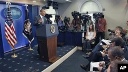 President Barack Obama answers questions about the ongoing budget negotiations during a press conference in the Brady Briefing Room of the White House, in Washington, DC, July 15, 2011