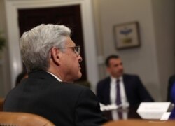 U.S. Attorney General Merrick Garland takes part in a meeting with President Joe Biden, law enforcement officials, and community leaders to discuss gun violence reduction strategies at the White House in Washington, July 12, 2021.