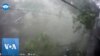 Moment Pole Falls on Motorcyclist During Vietnam Storm