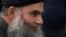 Abu Qatada arrives back at his residence in London after being freed from prison, Nov. 13, 2012.