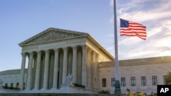 The flag flies at half-staff at the Supreme Court in Washington on Sept. 19, 2020, the morning after the death of Justice Ruth Bader Ginsburg, 87.