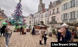 A Christmas market in the Medieval town Orleans where Attar lives.