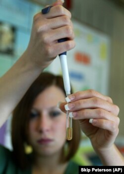 Brielle Hicks prepares to test the biodiesel fuel in a laboratory at Sinclair Community College in Dayton, Ohio.