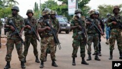 FILE - Ghana's military and police maintained order during the 2012 elections. Hikes in civil service wages during that election caused the deficit to soar.