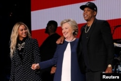 U.S. Democratic presidential nominee Hillary Clinton joins Jay Z and Beyonce onstage at a campaign concert in Cleveland, Ohio, U.S. November 4, 2016.