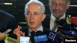 Former Colombian President Alvaro Uribe talks to the media in Rionegro, Colombia, July 30, 2018. 