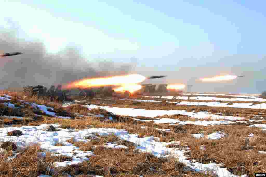 Soldiers of the Korean People's Army take part in landing and anti-landing drills in the eastern sector of the front and the east coastal area, North Korea, March 25, 2013.