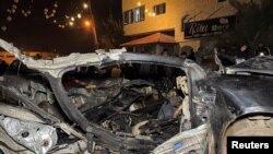 A car sits destroyed after it was hit in a deadly Israeli strike near Jenin in the Israeli-occupied West Bank on Jan. 24, 2025.