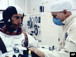 Astronaut Joseph Kerwin suits up.