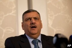 Riyad Hijab, head of the Syrian opposition High Negotiations Committee, gives a press conference in London, Feb. 10, 2016. The committee said Hijab thinks the chances of reaching an agreement on a political transition in Syria are “slim.”