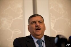 Riyad Hijab, head of the Syrian opposition High Negotiations Committee, gives a press conference in London, Feb. 10, 2016. The committee said Hijab thinks the chances of reaching an agreement on a political transition in Syria are “slim.”