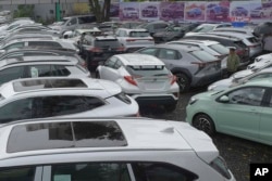 Electrical vehicles for sale parked at a car yard in Addis Ababa, Ethiopia on Thursday, Oct. 3, 2024. (AP Photo)