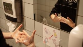 A pupil washes his hands at the Korshoejskolen school, after it reopened following the lockdown due to the coronavirus disease (COVID-19) spread, in Randers, Denmark, April 15, 2020.