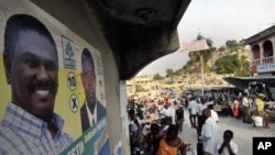 A poster of Haiti's presidential candidate Jude Celestin is seen in a street market in Port-au-Prince. A leaked report on Haiti's disputed November 28 elections by Organization of American States experts recommends that a government-backed presidential ca
