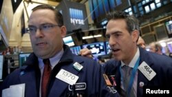 Traders work on the floor of the New York Stock Exchange in New York City, May 6, 2016.