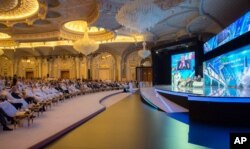 FILE - In this photo released by Saudi Press Agency, SPA, Saudi Crown Prince Mohammed bin Salman and the others attend the opening ceremony of Future Investment Initiative Conference in Riyadh, Saudi Arabia, Oct. 24, 2017.