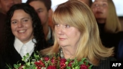 Vilija Blinkeviciute, leader of Lithuania's Social Democratic Party talks with journalists as exit poll results are announced in Vilnius, during the second round of parliamentary elections on Oct. 27, 2024. 