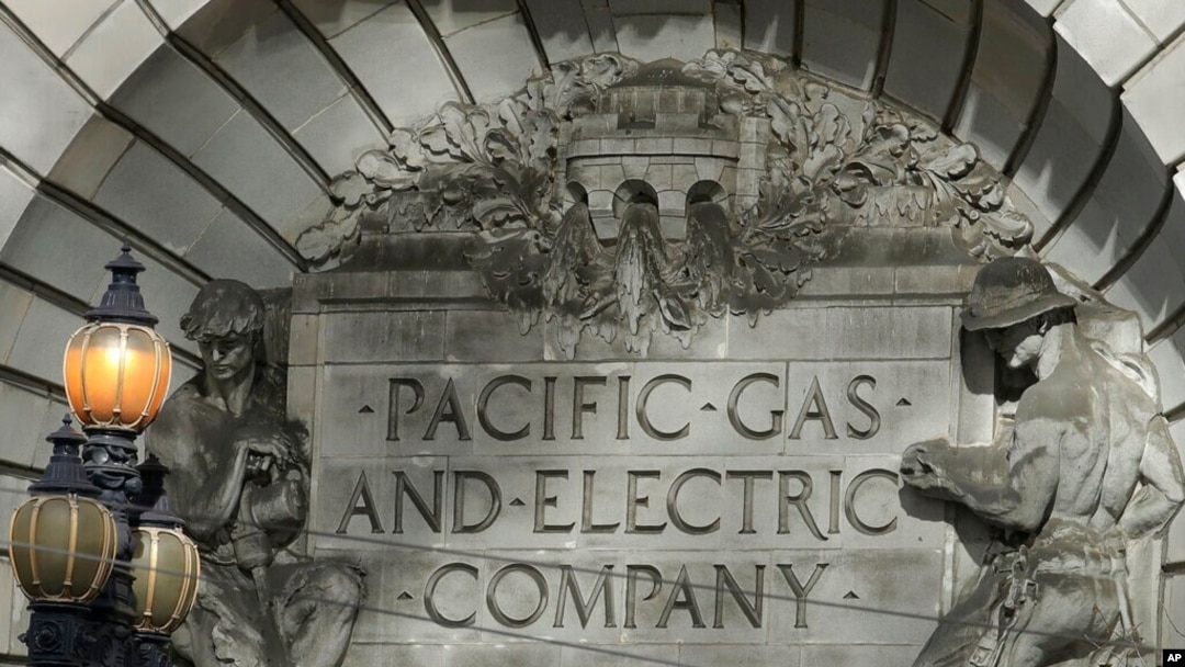 FILE - A Pacific Gas & Electric sign is shown outside a PG&E building in San Francisco, Oct. 10, 2019. 