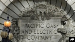 FILE - A Pacific Gas & Electric sign is shown outside a PG&E building in San Francisco, Oct. 10, 2019. 