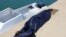 A bag containing the body of a migrant who died after a boat accident off the Libyan coast is seen at Qarabulli town, east of the capital Tripoli, June 2, 2019. 