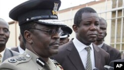 Kenyan Commissioner of Police Mathew Kirai Iteere, left, addresses media on the weekend attack on the police officers in Samburu, northwestern Kenya at Wilson Airport Nairobi, Kenya, Tuesday, Nov. 13, 2012.