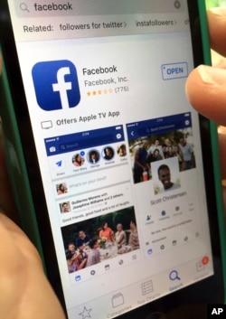 FILE - This photo shows Facebook launched on an iPhone, in North Andover, Mass., June 19, 2017.