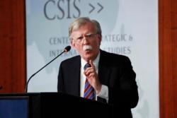 FILE - Former National Security Adviser John Bolton gestures while speaking at the Center for Strategic and International Studies in Washington, Sept. 30, 2019.