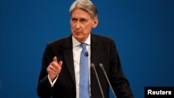 Britain's Chancellor of the Exchequer Philip Hammond speaks at the Conservative Party's conference in Manchester, Britain, Oct. 2, 2017.