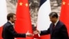 中国国家主席习近平即将对法国展开国事访问，引起法国的维吾尔人愤怒。图为去年4月法国总统马克龙访问中国。（路透社）
