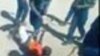 Police are seen in the video beating up the Zimbabwean with tree whips while laughing at the victim. (Photo of the video)