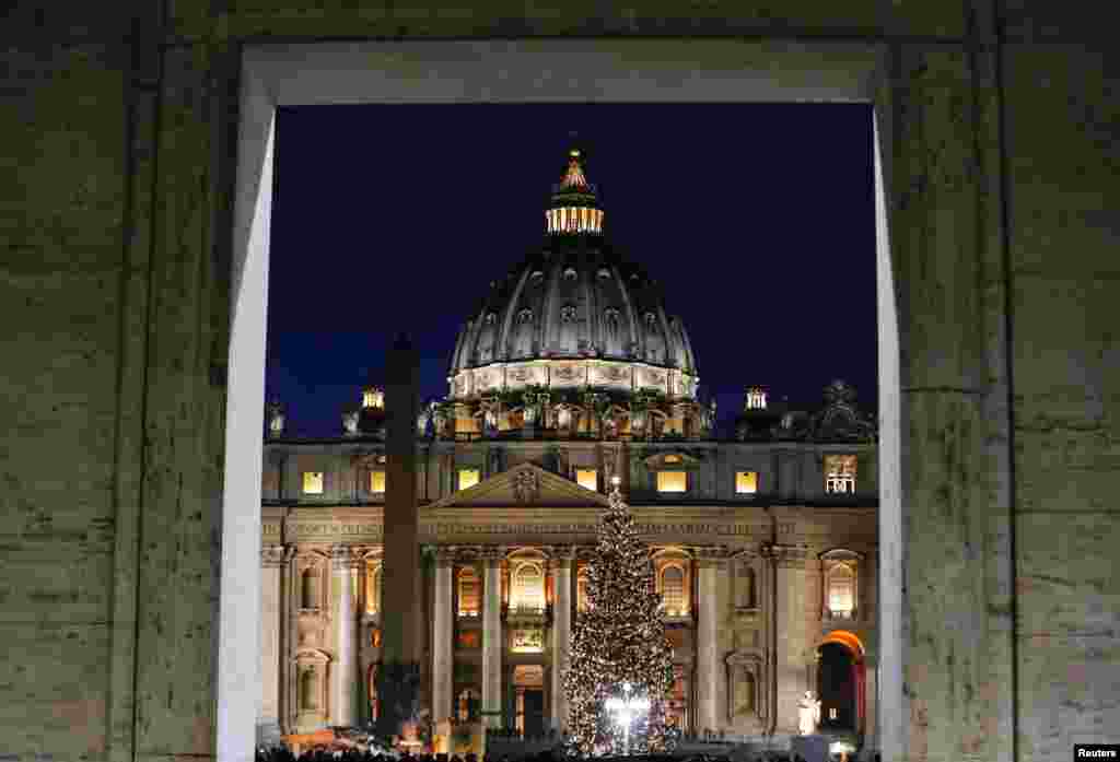 The Vatican Christmas tree is lit up during a ceremony in Saint Peter&#39;s Square at the Vatican, in Rome.