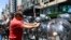 FILE - Demonstrators confront police to protest the economic reforms of Argentine President Javier Milei, outside the Supreme Court in Buenos Aires, Dec. 27, 2023.