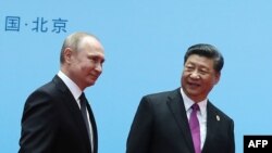 Le président chinois Xi Jinping (à droite) et le président russe Vladimir Poutine à Beijing le 27 avril 2019.