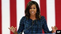 FILE - First lady Michelle Obama speaks at LaSalle University in Philadelphia, Sept. 28, 2016, as she campaigns for presidential candidate Hillary Clinton.