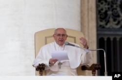 FILE - Pope Francis delivers his speech during the weekly general audience he held in St.Peter's Square, at the Vatican, March 16, 2016.