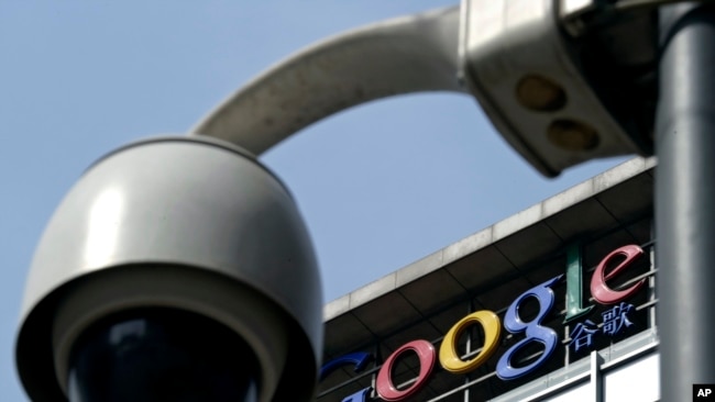 In this file photo from March 23, 2010, a surveillance camera is seen in front of the Google China headquarters in Beijing, China.