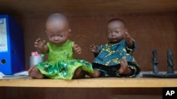 FILE—Dolls sit on a shelf in a room in a Doctors Without Borders Clinic in Bangui, Central African Republic, March 11, 2024.