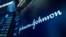 The Johnson & Johnson logo appears above a trading post on the floor of the New York Stock Exchange, Monday, July 12, 2021.