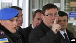 Yury Lutsenko, pointing finger, in a 2008 file photo, while he was Ukraine's interior minister