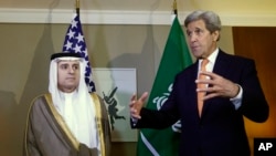 U.S. Secretary of State John Kerry, right, gestures next to Saudi Foreign Minister Adel al-Jubeir, left, during a meeting on Syria in Geneva, Switzerland, May 2, 2016.